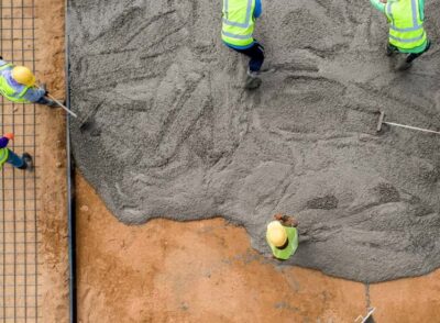 construction-worker-pouring-wet-concret-at-road-construction-site-2-1110x550 (1) construction-worker-pouring-wet-concret-at-road-construction-site-2-1110x550 (1)
